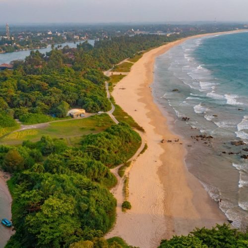 Aerial view of surfers near Hikkaduwa beach. Hikkaduwa, Sri Lanka.